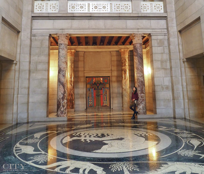 The rotunda marble mosaic floor and marble columns inside the Nebraska state capitol